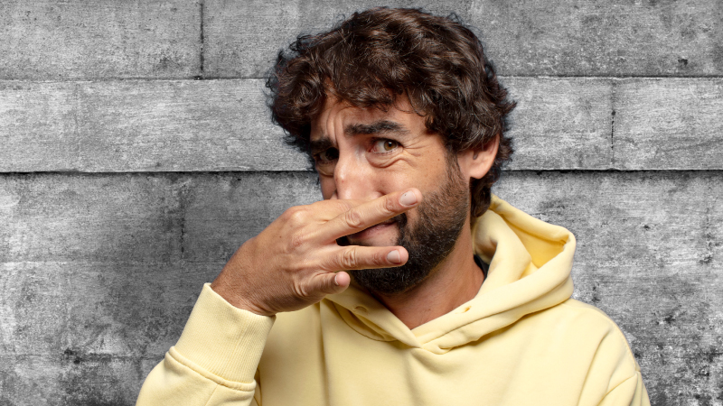 photo of a man in need of odor removal